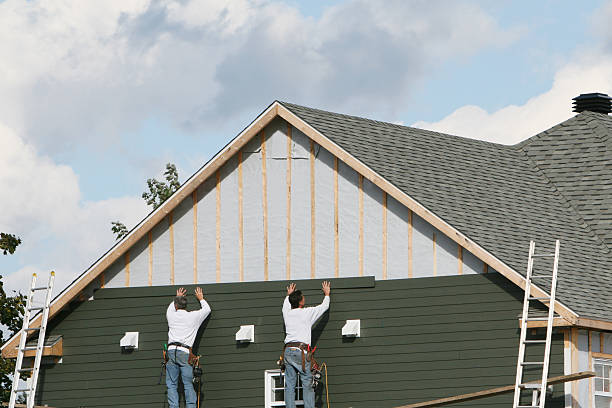 Professional Siding technician working in Winburne, PA
